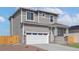 Charming two-story home featuring a two-car garage and neutral-toned siding at 17881 East 94Th Ave, Commerce City, CO 80022