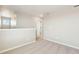 Neutral loft area showcasing carpet floors and access to additional rooms at 17881 East 94Th Ave, Commerce City, CO 80022