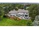 Aerial view of a home highlighting the backyard with patio, lush landscaping, and overall property layout at 5698 Green Oaks Dr, Greenwood Village, CO 80121