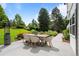 Outdoor dining area surrounded by lush landscaping and greenery at 5698 Green Oaks Dr, Greenwood Village, CO 80121