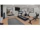 Home gym features a treadmill, exercise bike, and mirrors at 5698 Green Oaks Dr, Greenwood Village, CO 80121