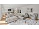 Spacious living room with hardwood floors and access to the kitchen at 5698 Green Oaks Dr, Greenwood Village, CO 80121