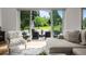 Bright living room with sliding glass doors leading to a lovely patio at 5698 Green Oaks Dr, Greenwood Village, CO 80121