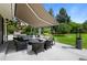 Covered patio with comfortable seating, perfect for outdoor entertaining at 5698 Green Oaks Dr, Greenwood Village, CO 80121