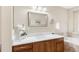 Bathroom showcasing a wood vanity with white countertop and stylish fixtures at 2958 N Xenia St, Denver, CO 80238