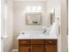 Bathroom featuring a wood vanity with white countertop and modern fixtures at 2958 N Xenia St, Denver, CO 80238