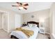 Comfortable bedroom with a ceiling fan, neutral color palette, and a cozy bed with stylish accent pillows at 2958 N Xenia St, Denver, CO 80238