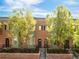 Charming brick townhome with manicured landscaping and inviting front entryway at 2958 N Xenia St, Denver, CO 80238