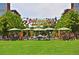 Lush green park with picnic tables, colorful decorations, and a festive, inviting atmosphere for community gatherings at 2958 N Xenia St, Denver, CO 80238