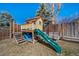 Fun backyard playhouse featuring a slide, play area, and seating at 2159 Beacham Dr, Castle Rock, CO 80104