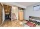 A versatile basement area featuring ample storage, stairs, and a cozy rug for added comfort at 5404 W Canyon Trl # C, Littleton, CO 80128