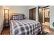 Comfortable bedroom featuring a bed with wood floors, and a closet at 5404 W Canyon Trl # C, Littleton, CO 80128