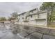 Street view of multi-story townhouses, each with front-facing garage and private balcony at 5404 W Canyon Trl # C, Littleton, CO 80128