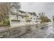 Street view of townhouses, each with garage and balcony, in a well-maintained community at 5404 W Canyon Trl # C, Littleton, CO 80128