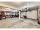 A spacious garage with storage cabinets, overhead lighting, and ample room for multiple vehicles and equipment at 5404 W Canyon Trl # C, Littleton, CO 80128
