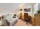 Cozy home office featuring a comfortable couch, a desk with a chair, and decor at 5404 W Canyon Trl # C, Littleton, CO 80128