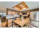 Well-lit kitchen with wooden cabinets, stainless steel appliances, and a kitchen island with stools at 5404 W Canyon Trl # C, Littleton, CO 80128