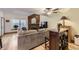 Comfortable living room with a plush sectional couch, a cozy fireplace, and hardwood floors at 5404 W Canyon Trl # C, Littleton, CO 80128