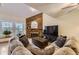 Spacious living room featuring plush seating, wood floors, and a cozy fireplace at 5404 W Canyon Trl # C, Littleton, CO 80128