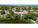Overhead view showcasing a residential complex beside a pond with walking path and lush greenery at 12156 Melody Dr # 201, Westminster, CO 80234