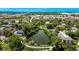 Community aerial view featuring a pond, green spaces, and walking paths at 12156 Melody Dr # 201, Westminster, CO 80234