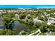 Picturesque aerial view of the residential area with a calming pond and landscaped surroundings at 12156 Melody Dr # 201, Westminster, CO 80234