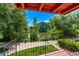 Balcony overlooking a pond, greenery, and neighborhood homes at 12156 Melody Dr # 201, Westminster, CO 80234