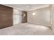 Bedroom with neutral carpet, an octagon window, and sliding-door closet at 12156 Melody Dr # 201, Westminster, CO 80234