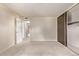 Bedroom features neutral carpet, a closet with sliding doors, and a door leading to hallway at 12156 Melody Dr # 201, Westminster, CO 80234
