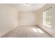 Inviting bedroom with neutral decor, featuring a window that provides natural light, and plush carpeting, creating a relaxing space at 12156 Melody Dr # 201, Westminster, CO 80234