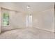 Bedroom with neutral carpet, a double-hung window, and a door leading to hallway at 12156 Melody Dr # 201, Westminster, CO 80234