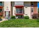 Apartment building exterior with well-manicured lawn and balconies at 12156 Melody Dr # 201, Westminster, CO 80234
