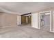 The living room showcases an open layout with access to the kitchen and multiple entryways at 12156 Melody Dr # 201, Westminster, CO 80234