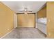Open-concept living area with ceiling fan, seamlessly connecting to dining and kitchen spaces, enhancing functionality at 12156 Melody Dr # 201, Westminster, CO 80234
