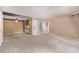Open living room with neutral tones and carpet, offering a versatile living space at 12156 Melody Dr # 201, Westminster, CO 80234