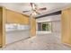 Bright and airy living area with a pass through to the kitchen, offering a seamless flow to the outdoor balcony at 12156 Melody Dr # 201, Westminster, CO 80234