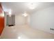 Expansive basement featuring a red accent wall, neutral carpet, and recessed lighting at 1578 S Syracuse St, Denver, CO 80231