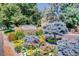 Beautiful community entrance sign with colorful flowers and landscaping at 1578 S Syracuse St, Denver, CO 80231