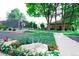 Community tennis courts surrounded by lush green landscaping and mature trees at 1578 S Syracuse St, Denver, CO 80231