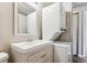 Bathroom features a vanity with a mirror and stackable washer/dryer at 875 S Quebec St # 24, Denver, CO 80247