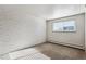 Bedroom with hardwood floors and an accent wall at 875 S Quebec St # 24, Denver, CO 80247