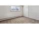 Simple bedroom with carpet, window, and baseboard heating at 875 S Quebec St # 24, Denver, CO 80247