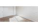 Bright bedroom with white painted brick wall and carpet at 875 S Quebec St # 24, Denver, CO 80247