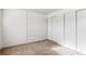 Spacious bedroom with large closet and white brick wall at 875 S Quebec St # 24, Denver, CO 80247