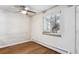 Bright dining area with white brick accent wall and hardwood floors at 875 S Quebec St # 24, Denver, CO 80247