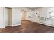 Living room with wood-look floors and an exterior door at 875 S Quebec St # 24, Denver, CO 80247