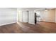 Spacious living room with hardwood floors and access to kitchen at 875 S Quebec St # 24, Denver, CO 80247
