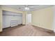 Comfortable bedroom with a closet, ceiling fan, and soft carpet at 1074 S Dearborn St # 103, Aurora, CO 80012