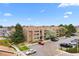 Aerial view of an attractive condo complex featuring mature landscaping and convenient parking at 1074 S Dearborn St # 103, Aurora, CO 80012