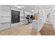 Bright kitchen with modern appliances, chalkboard accent wall and pass through to the living room at 1074 S Dearborn St # 103, Aurora, CO 80012